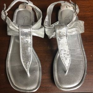 Jessica Simpson silver sandals. Gently used. See photos for minor wear on soles.